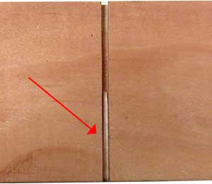 Glue toothpick in pinewood derby car slot